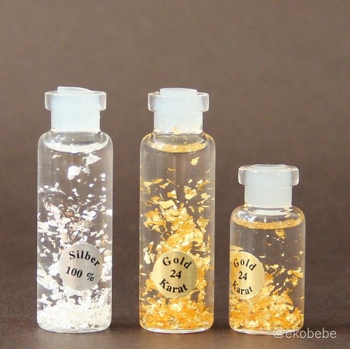 Gold and Silver Flakes in Glass Bottle